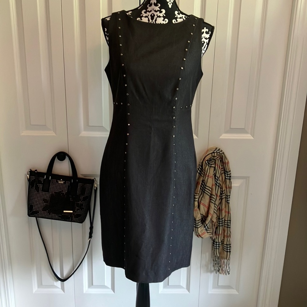 Fabulous gray rounded neckline sleeveless dress with silver stud detail.